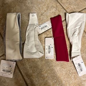 4 headbands. Mostly white one burgundy